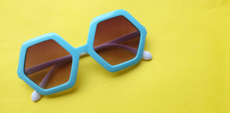 A pair of colourful geometric sunglasses.