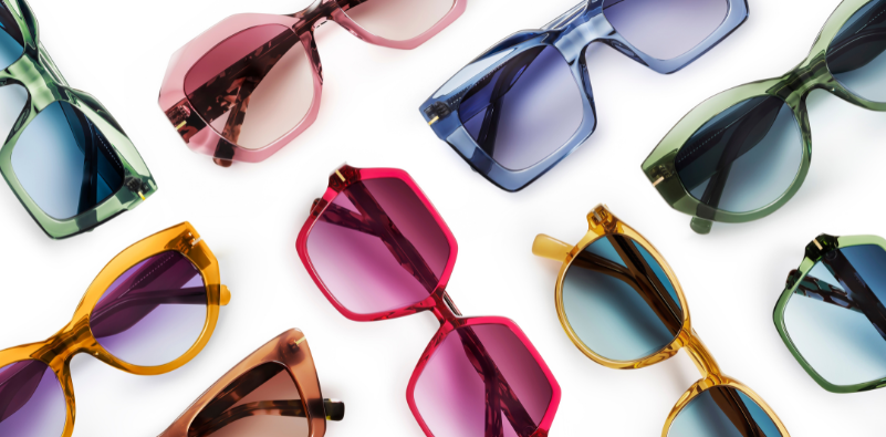 A collection of colourful, transparent sunglasses.